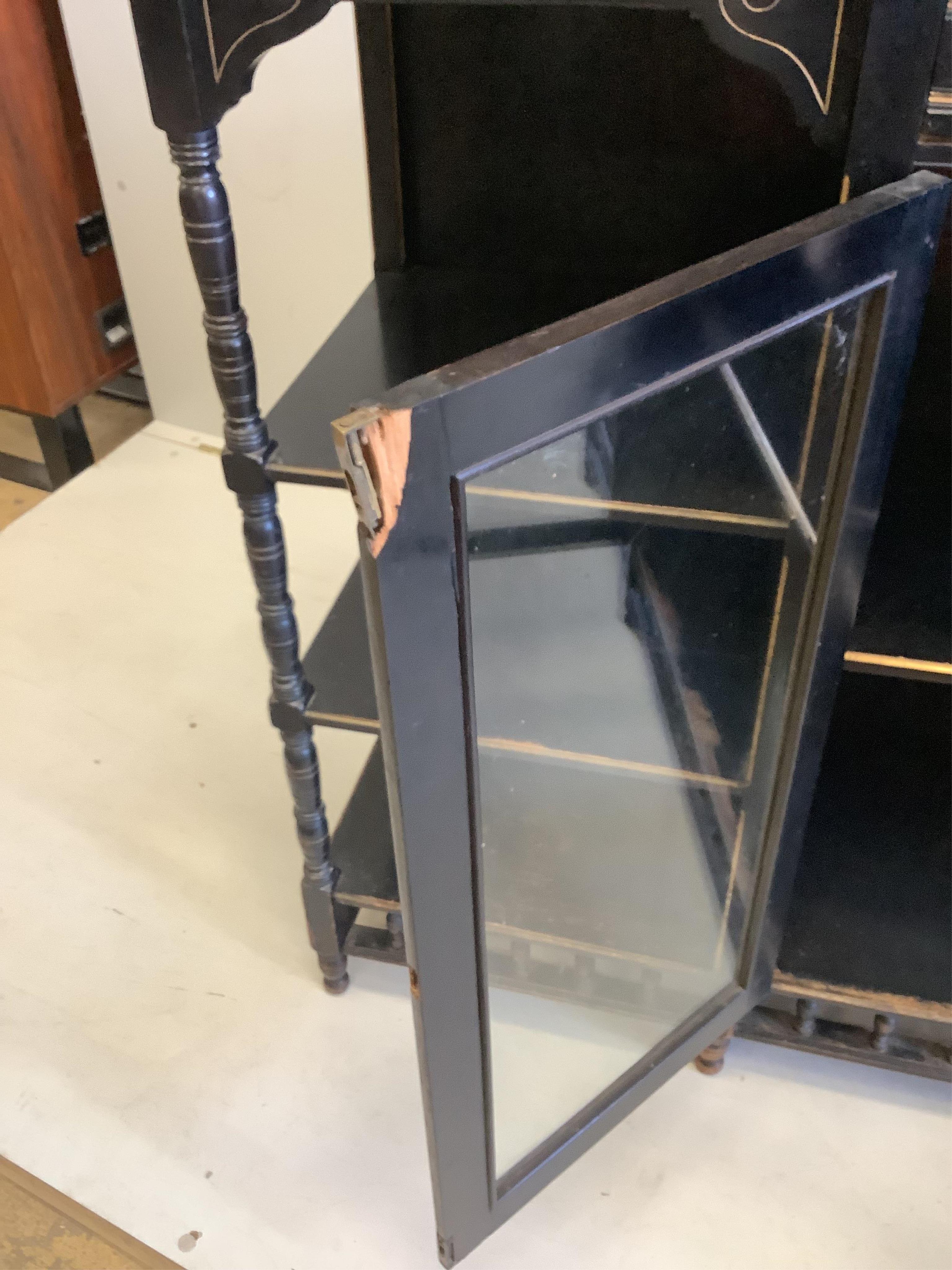 A late Victorian Aesthetic Movement ebonised side cabinet, width 167cm, depth 43cm, height 105cm. Condition - poor